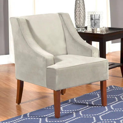Poltrona decorativa in velluto grigio tortora con braccioli curvi